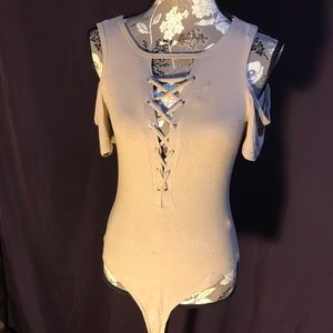 Deep V-neck lace up body suit